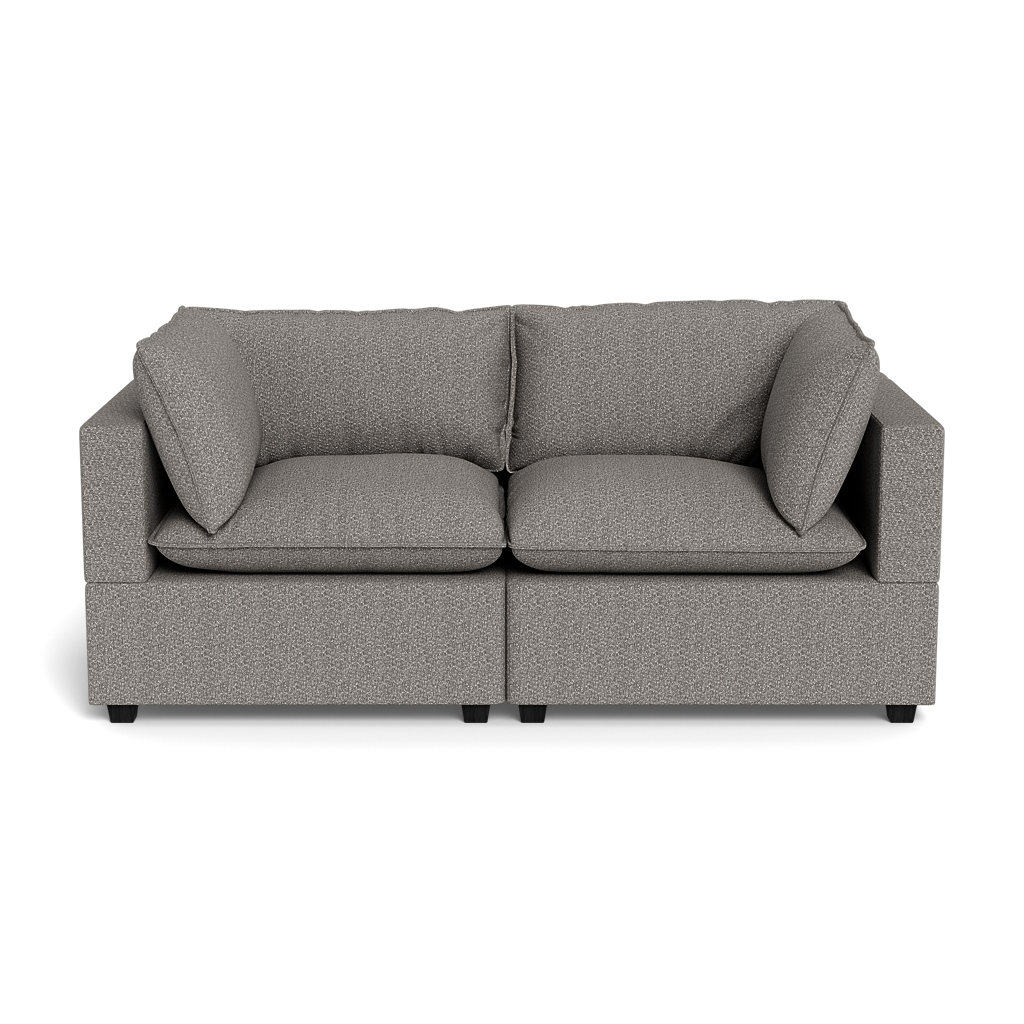 The Kova Pillow Cushion Sofa 86" is a modern gray upholstered sofa featuring two seat cushions and two large matching backrest pillows, displayed against a black background.