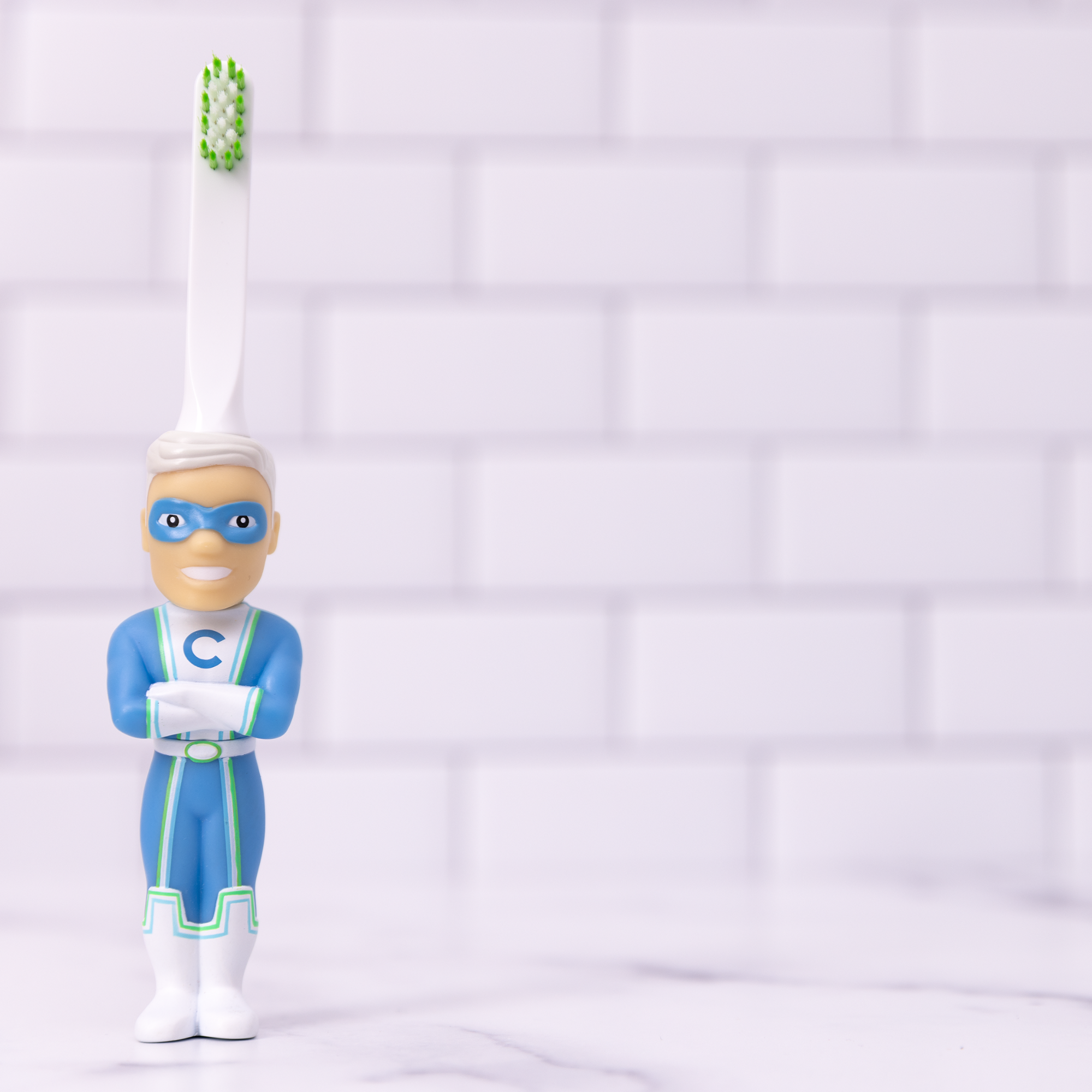 My Store kids character toothbrush with superhero design and green bristles on white handle